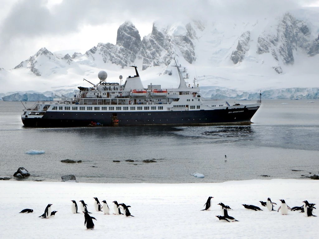 The cruise ship Sea Adventurer lies at anchor between Ronge Island and the Antarctic Peninsula.