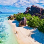 couple at seychells-la-digue-anse-source-d-argent- how to choose the perfect beach vacation